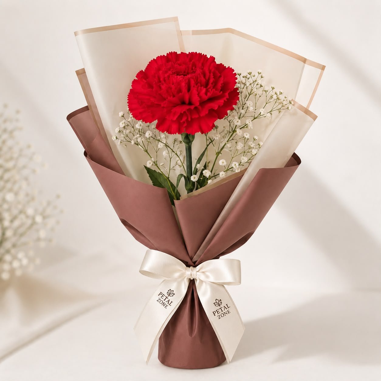 A Crimson Whisper – Single Red Carnation Flat Bouquet