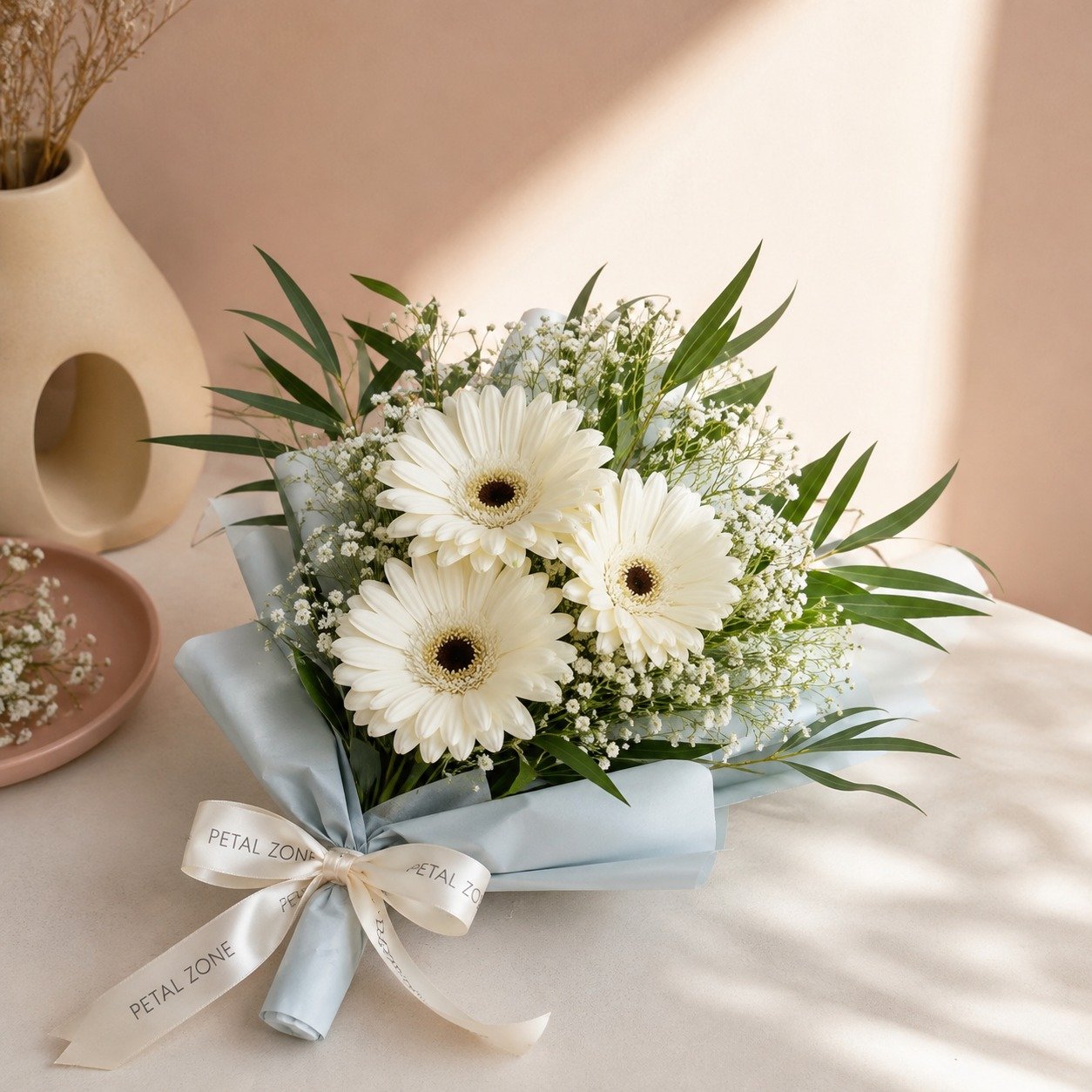 Three Petals of Purity – 3 White Gerberas Flat Bouquet